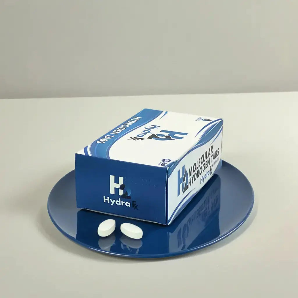 HydraFx Hydrogen Tablets on a blue plate, dietary supplement for wellness enhancement.