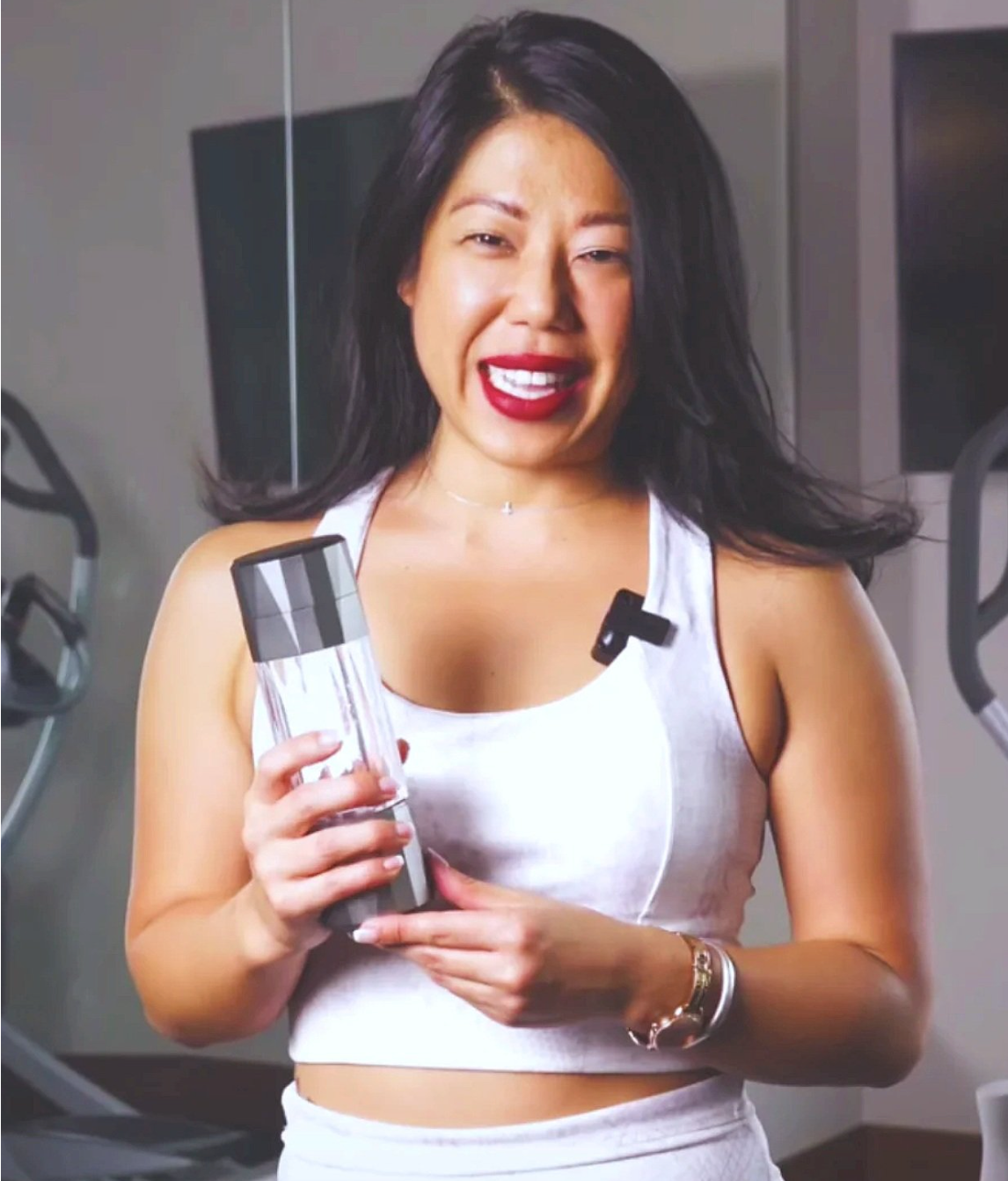 Woman holding Hydrogen Water Bottle - Hydra Shot Healthy Hydration