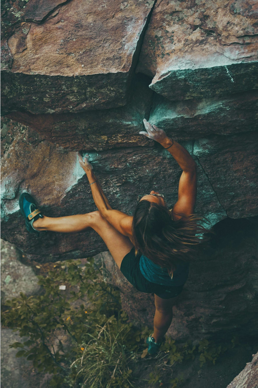Woman climbing on mountain